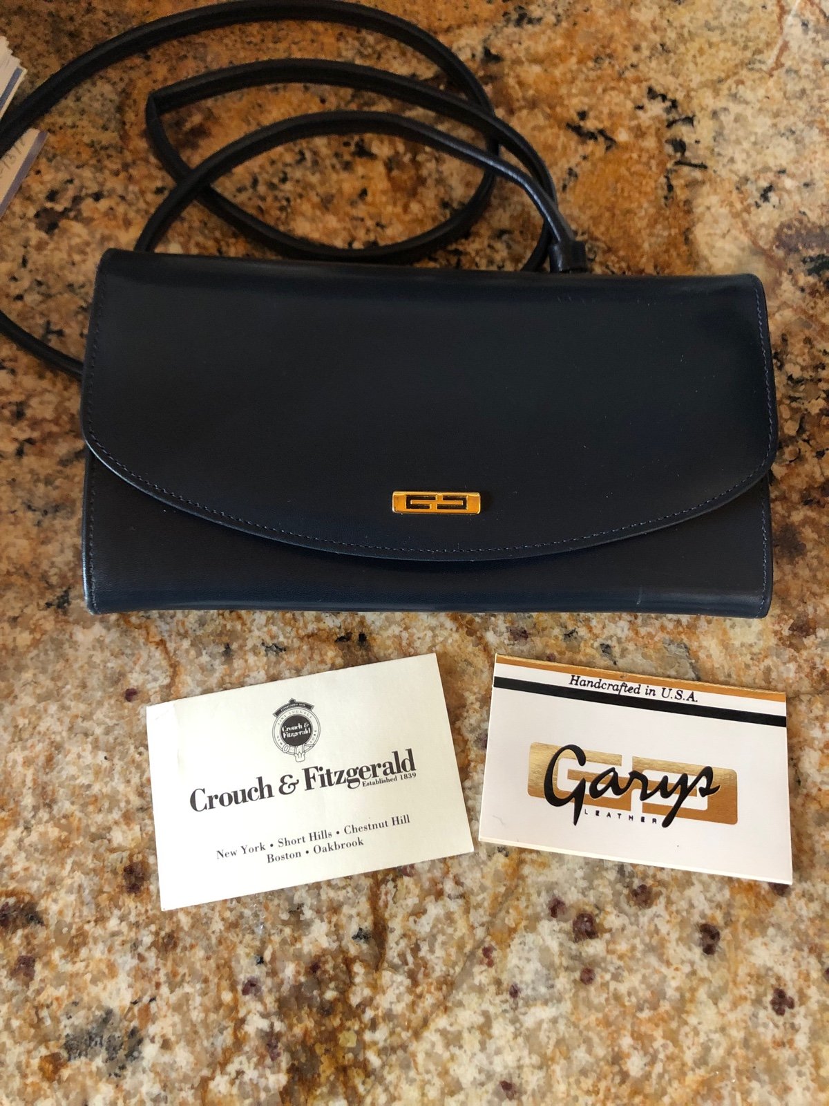Gary’s navy leather shoulder clutch