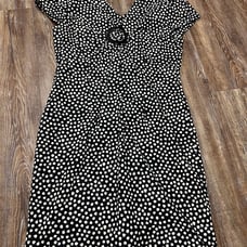 Vintage Howard Wolf black and white polka dot midi dress with a v-neckline