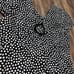 Vintage Howard Wolf black and white polka dot midi dress with a v-neckline