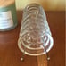 Vintage glass coasters with metal caddy