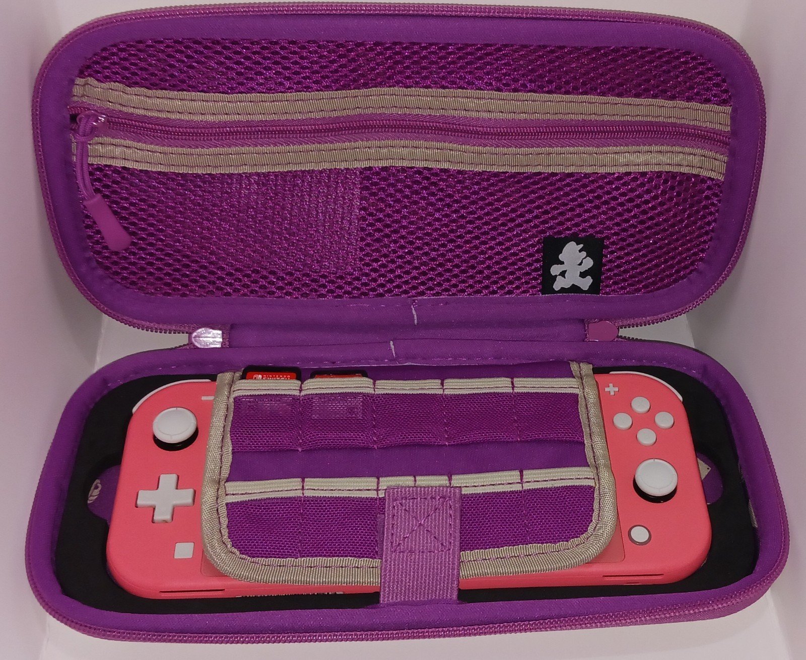 Nintendo Switch Lite Coral with Mario Party and Smash Bros Ultimate and more