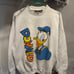 Vintage 1990s Donald Duck AOP Disney sweater