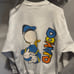 Vintage 1990s Donald Duck AOP Disney sweater