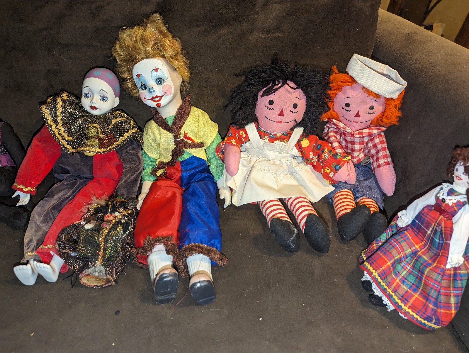 Dolls dolls raggedy Ann doll and raggedy Andy and other porcelain wind up clowns