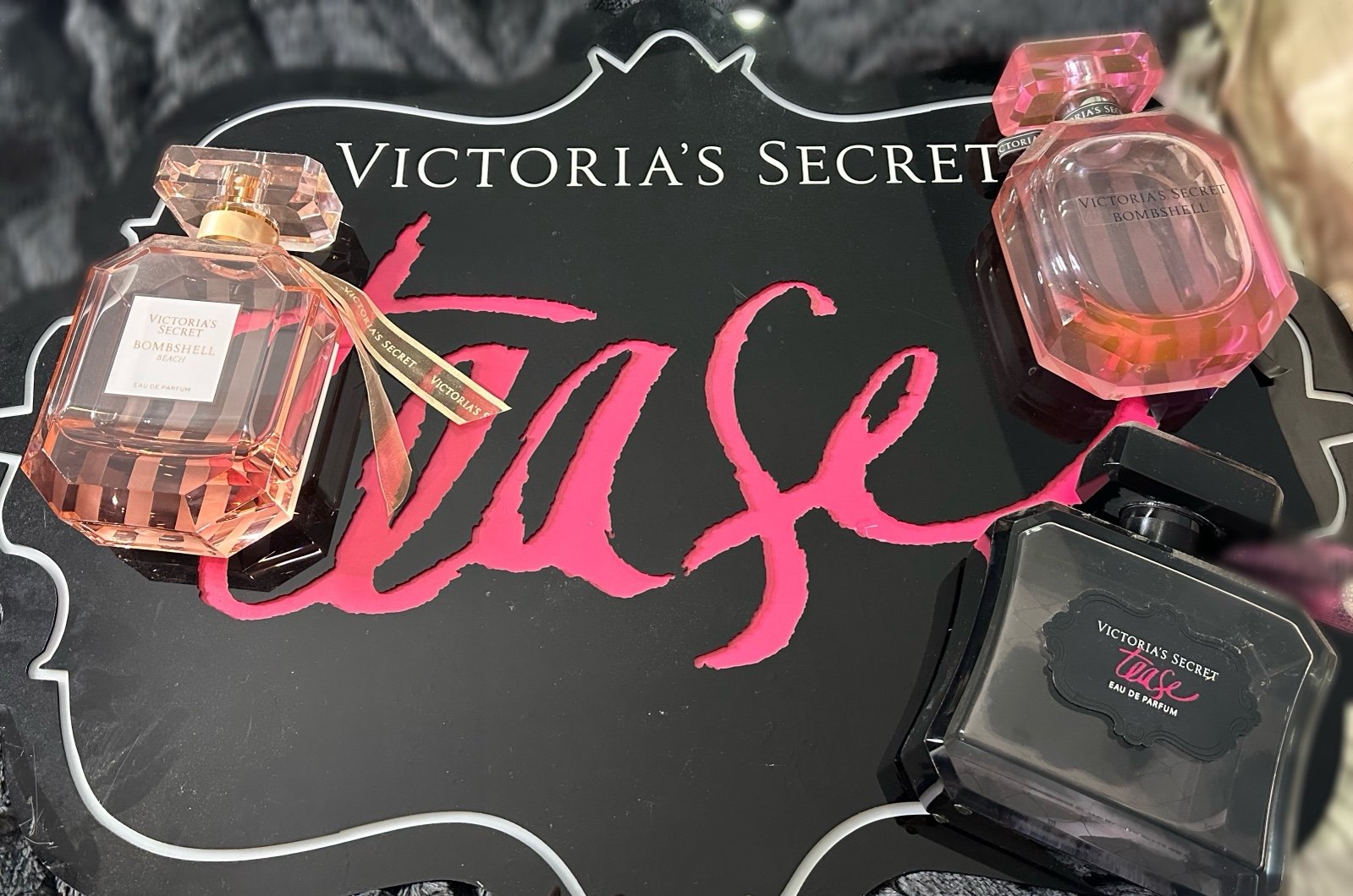 victoria secret display bottles and sign
