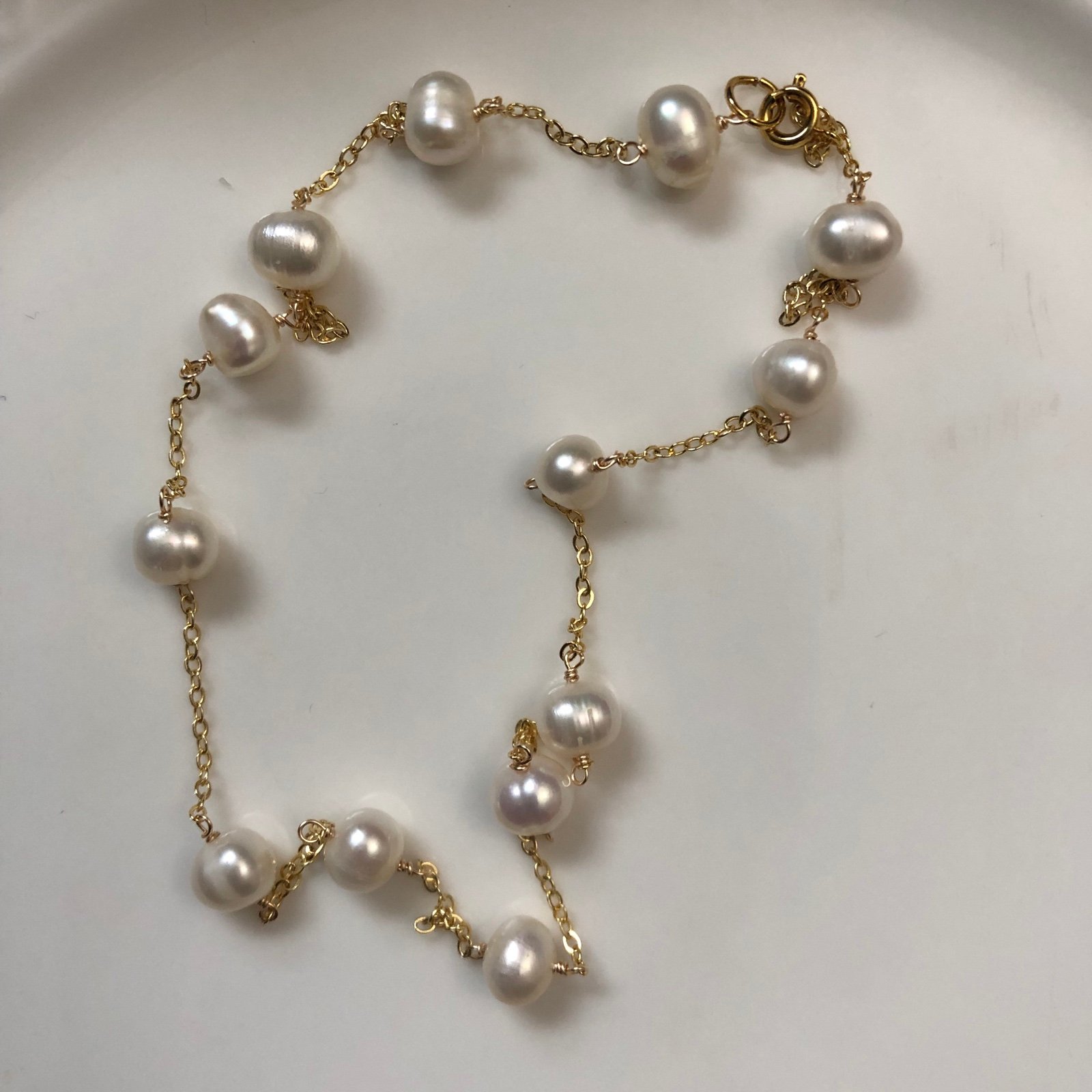 Hand wired white freshwater pearl station chain necklace in 14k gold plated wire