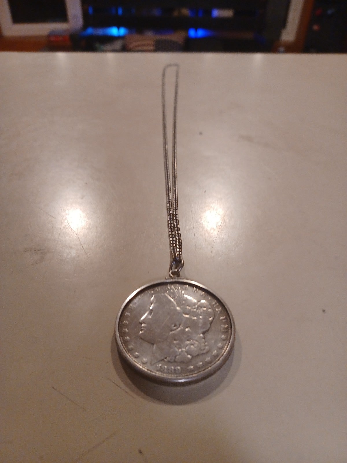 This is a real silver dollar not a knock off or fake it is on a 24 inch chain
