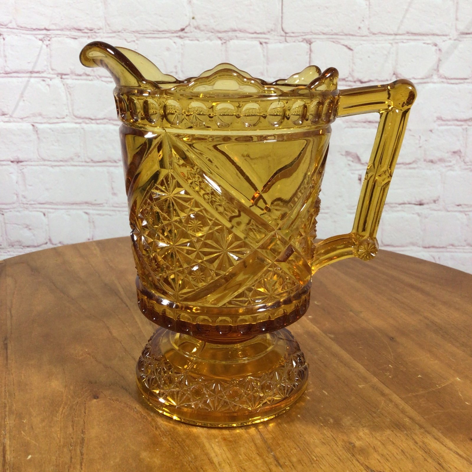 Vintage Richards and Hartley Daisy and Buttons Amber Glass Footed Pitcher
