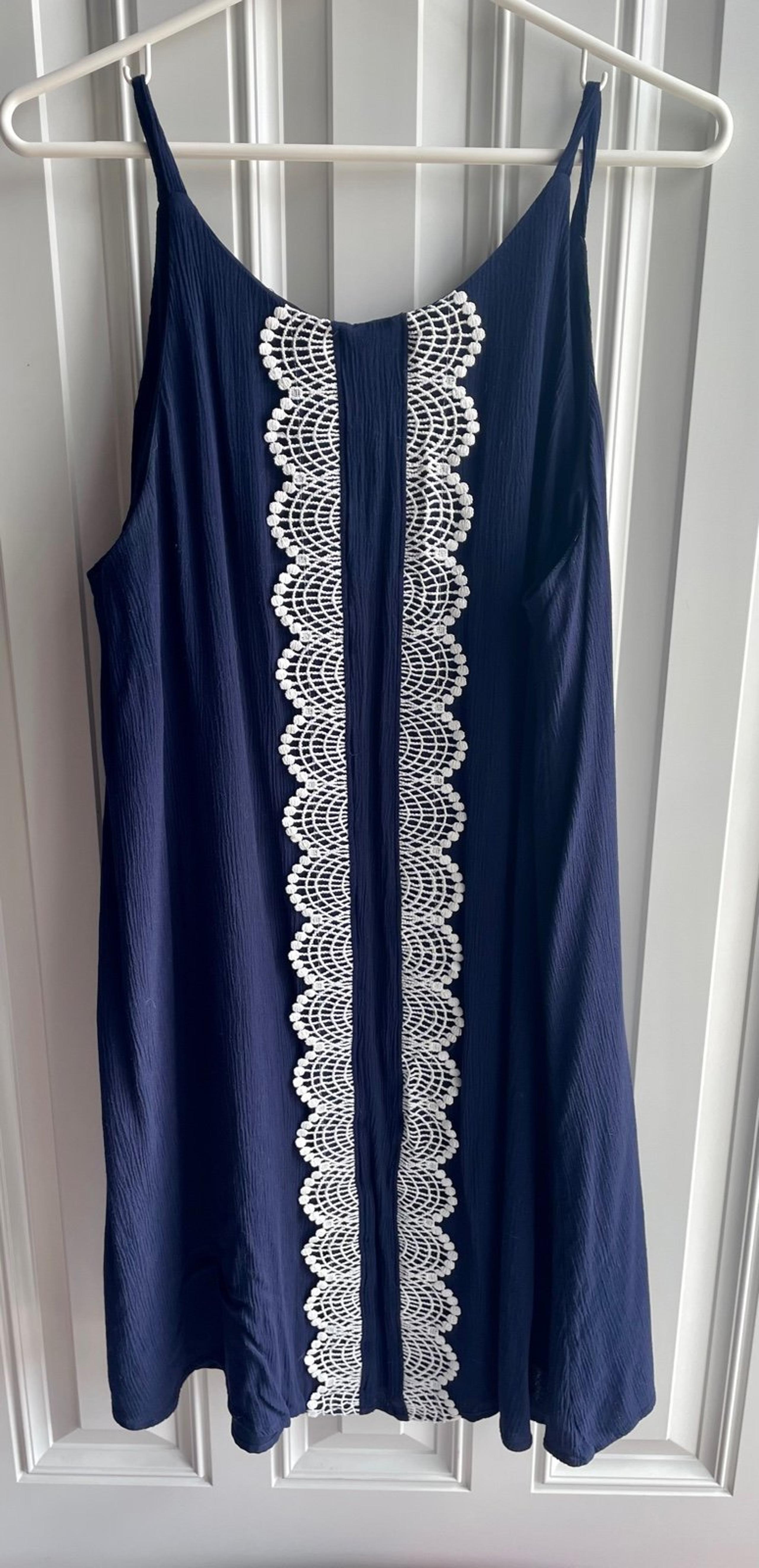 Navy blue spaghetti strap dress with white lace detail