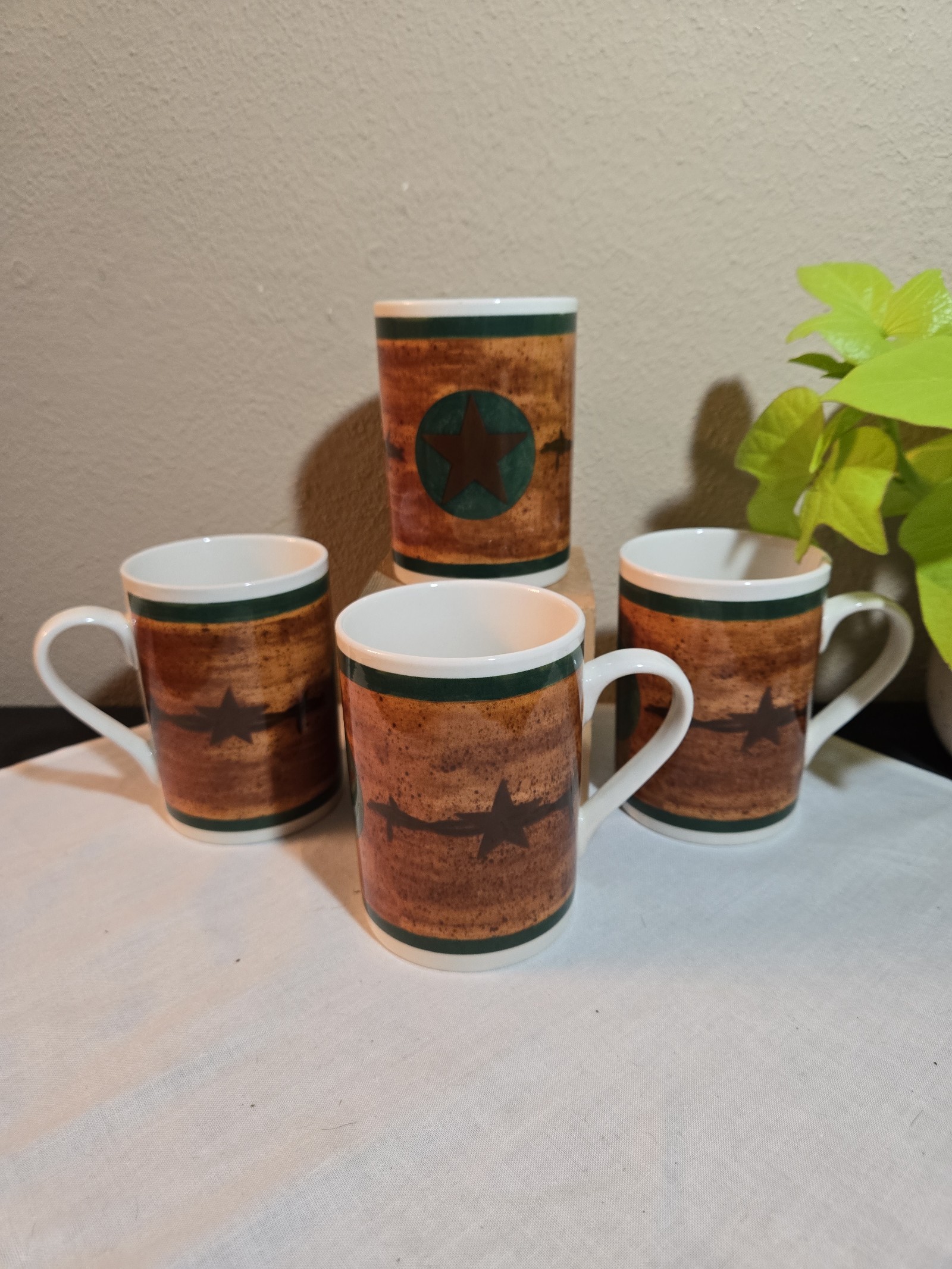 Western Moments Set Of Four Star Coffee Mugs.