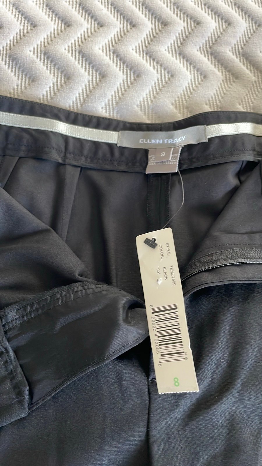 Ellen Tracy pants made of 97% wool 3% spandex.