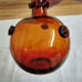 Vtg. amber art glass bottle; nodules/rigaree trim; handmade.
