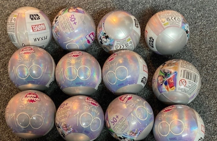 12 of Disney 100 Mini Brands plus Platinum Elsa