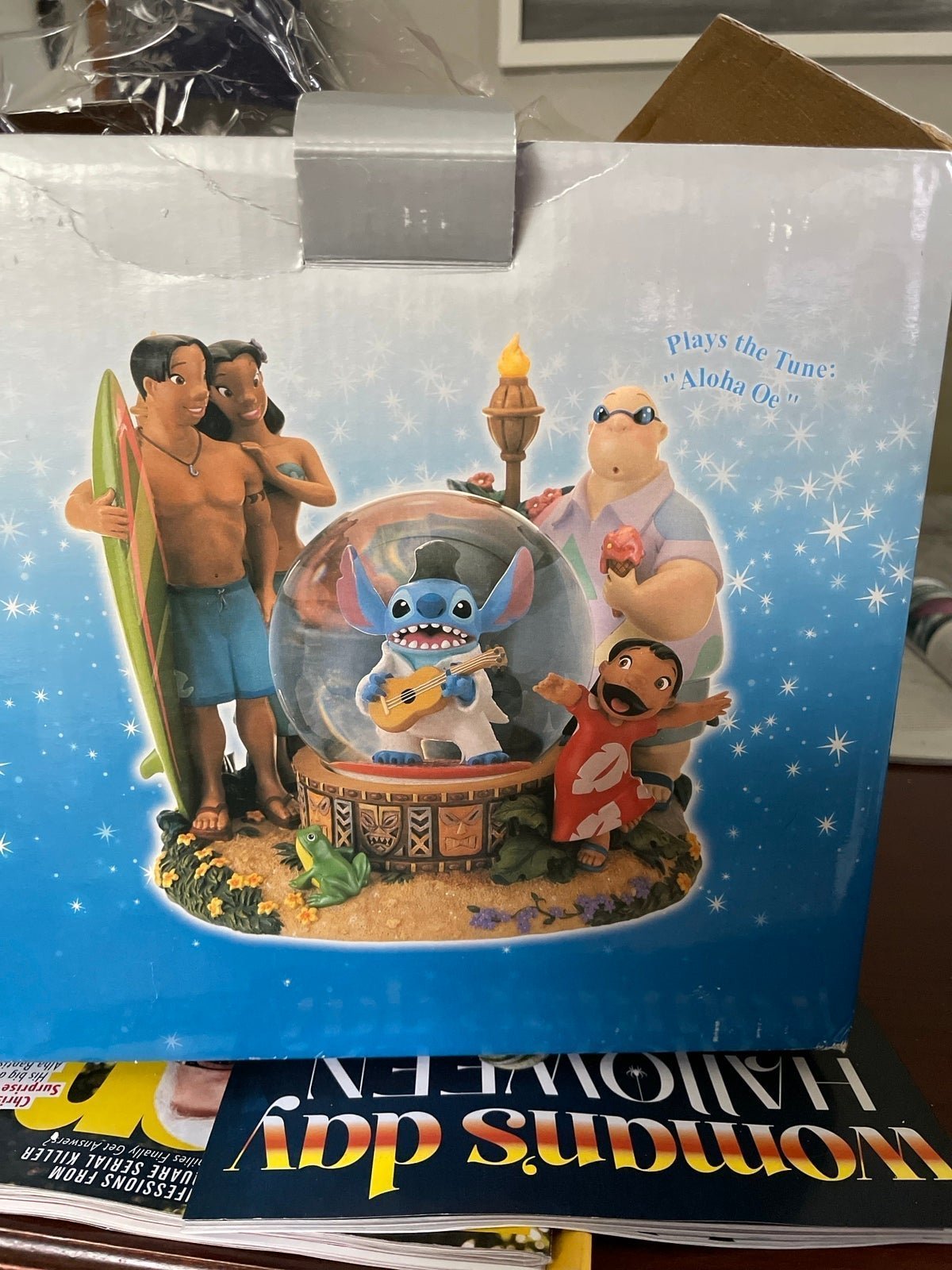 Elvis Stitch globe. Music box sings Aloha Oe”