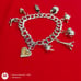 Vtg Sterling Silver Double Linked Charm Bracelet with 9 Sterling Silver Charms.