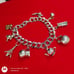 Vtg Sterling Silver Double Linked Charm Bracelet with 9 Sterling Silver Charms.
