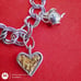 Vtg Sterling Silver Double Linked Charm Bracelet with 9 Sterling Silver Charms.