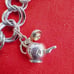 Vtg Sterling Silver Double Linked Charm Bracelet with 9 Sterling Silver Charms.