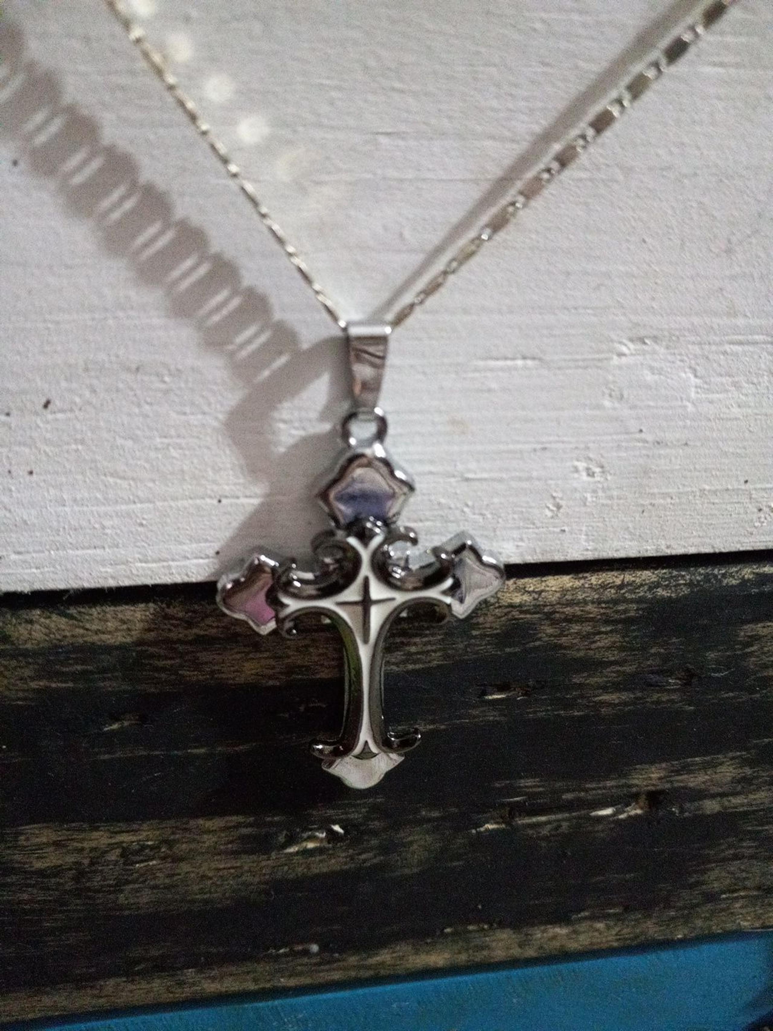 Silver and white  Gothi cross.