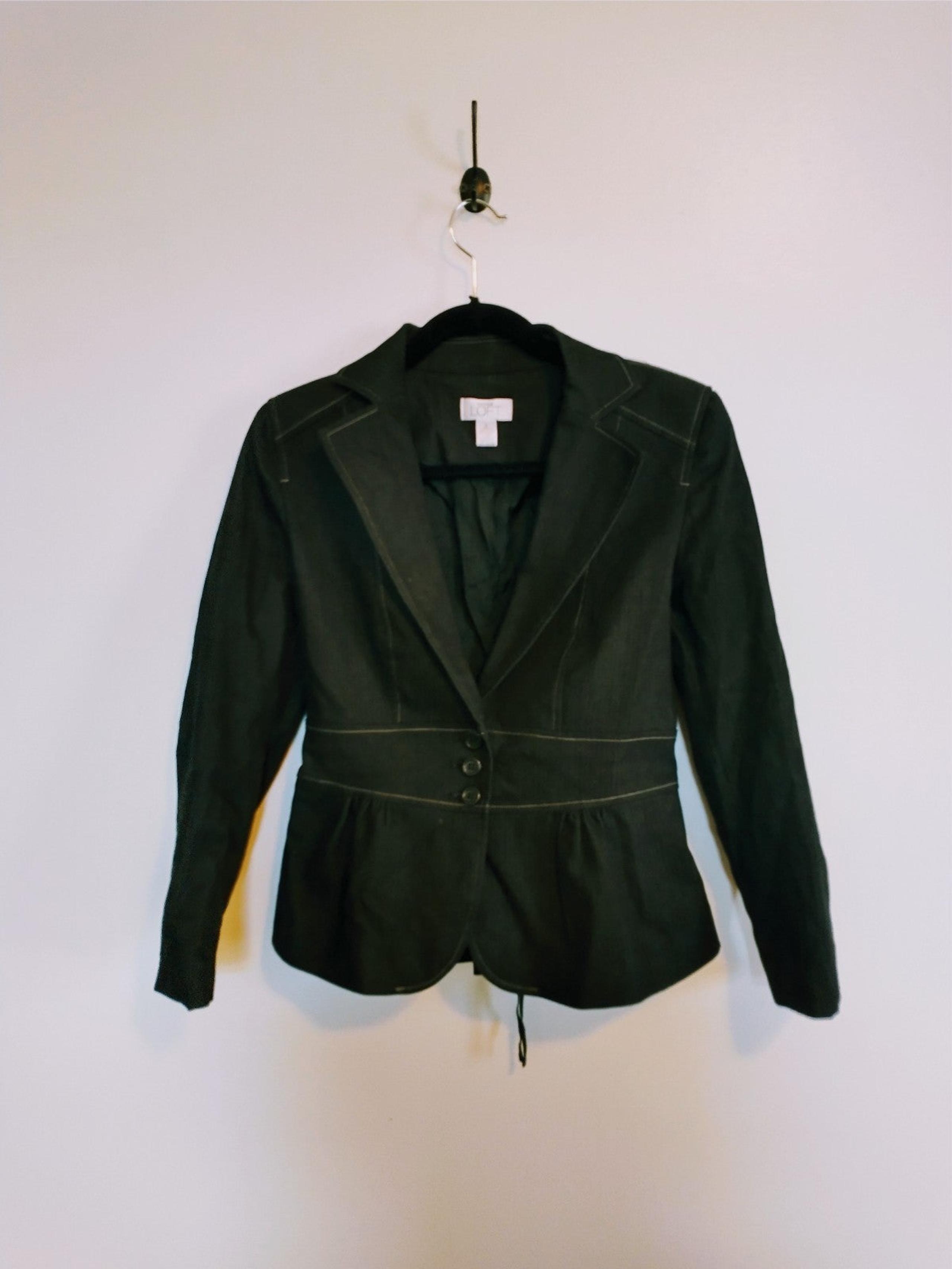 Loft dark grey blazer with lace up detail on the back. Size 4 with peplum and bu