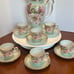 Chocolate or tea pot with cups and saucers