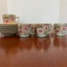 Chocolate or tea pot with cups and saucers