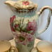 Chocolate or tea pot with cups and saucers