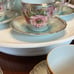 Chocolate or tea pot with cups and saucers
