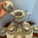 Chocolate or tea pot with cups and saucers