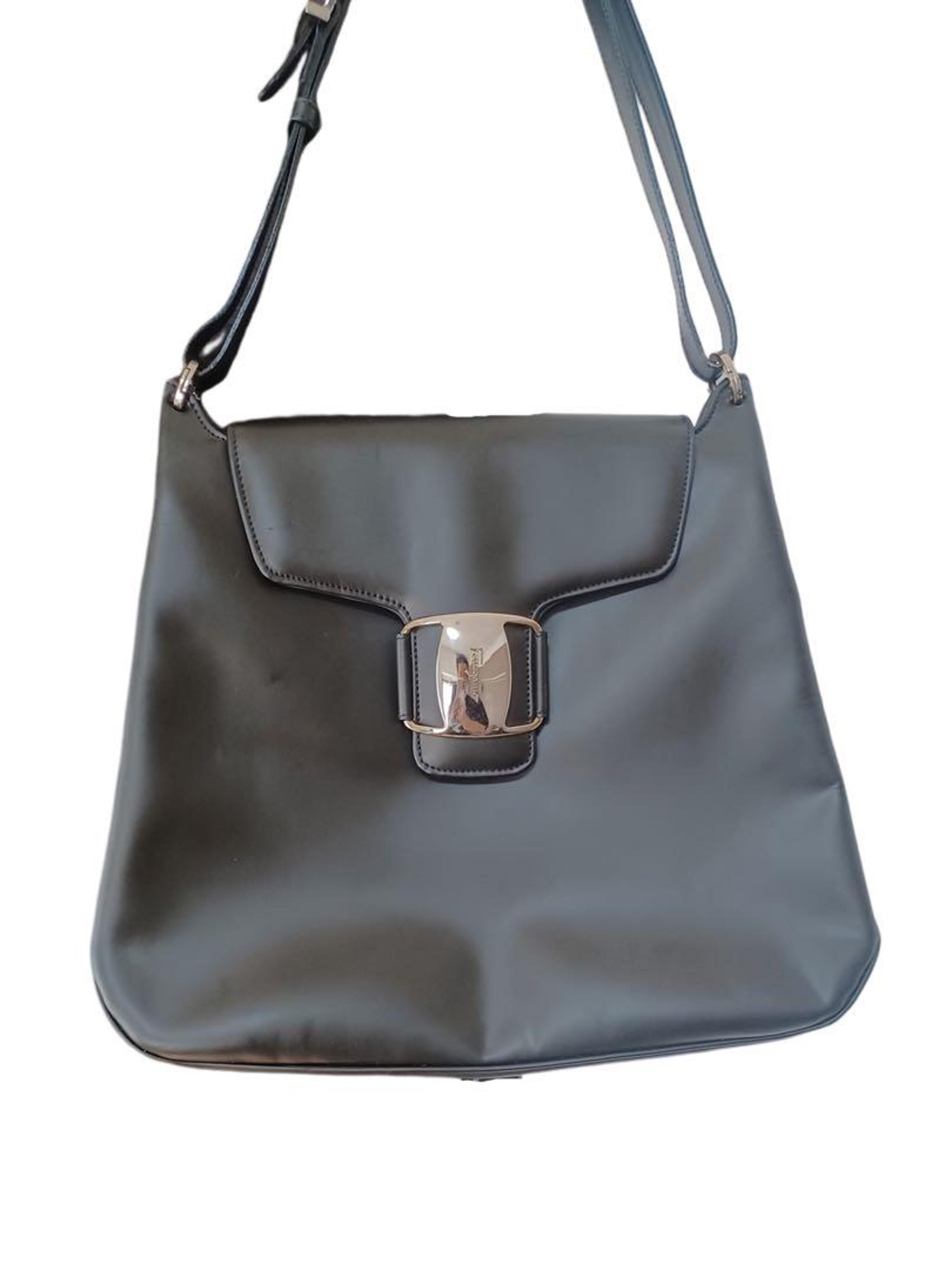 Ferragamo shoulder bag, black, leather, sophisticated luxury.