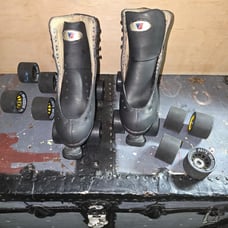 Matte black artistic Riedell quad skates