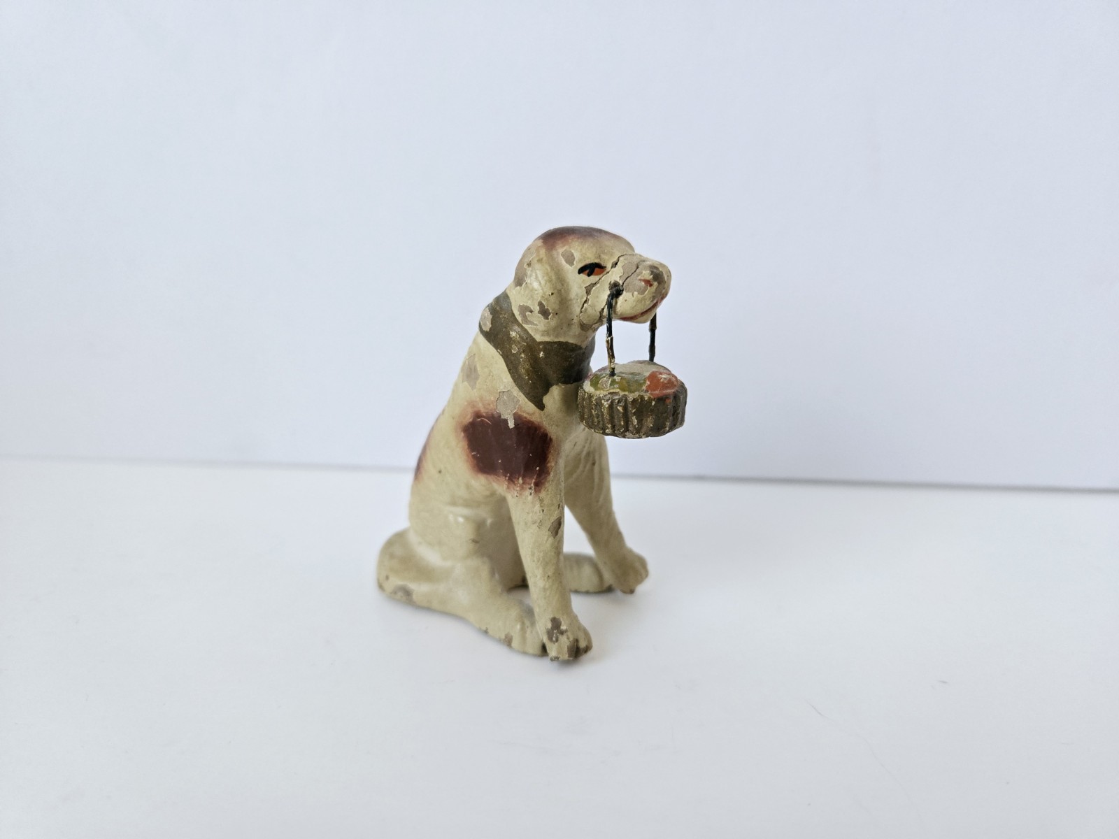 Antique village animal putz dog miniature mini with basket in his mouth 2 1/2 