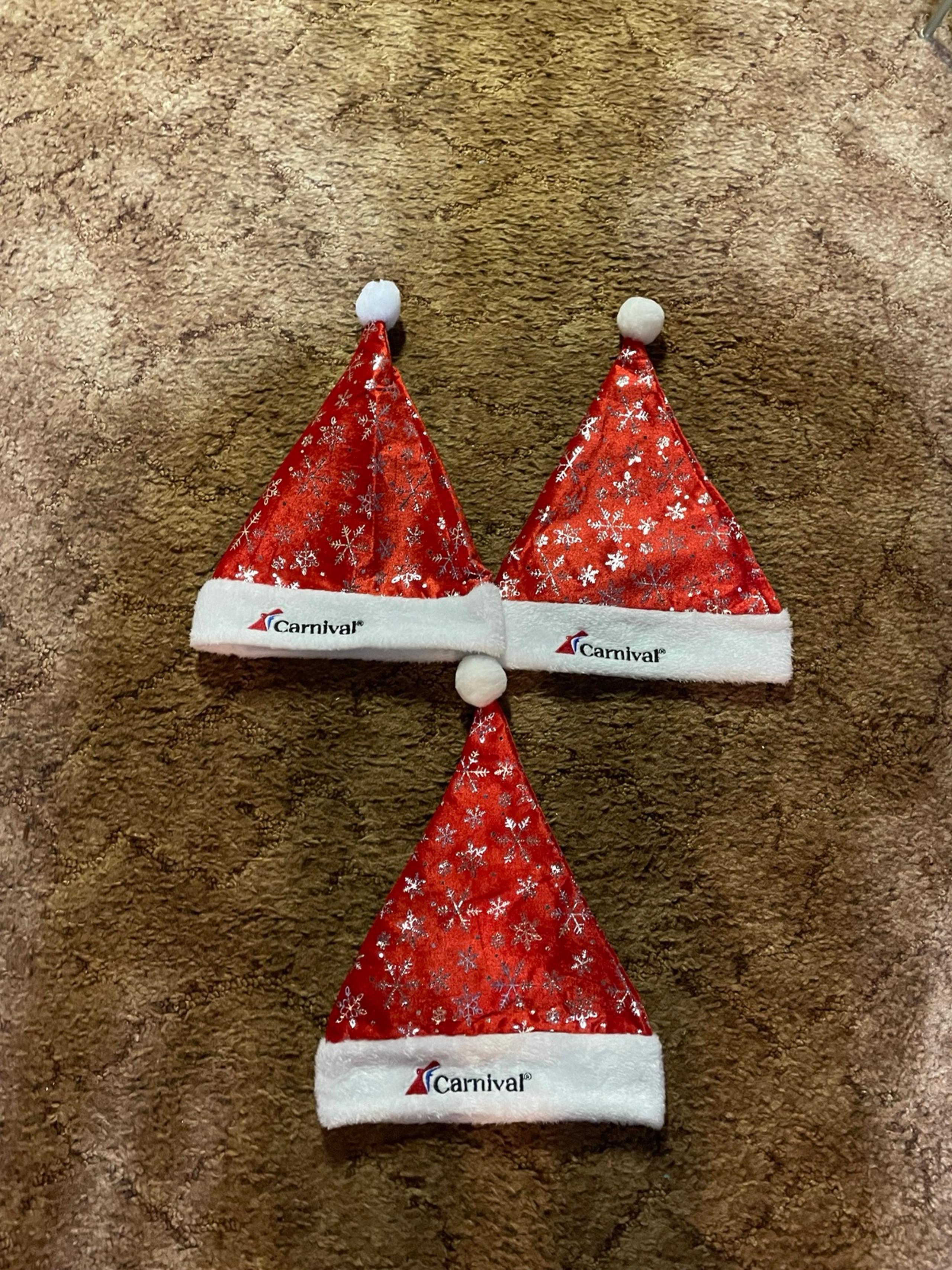 3 carnival cruise line winter Christmas Santa hats. Red with snowflakes