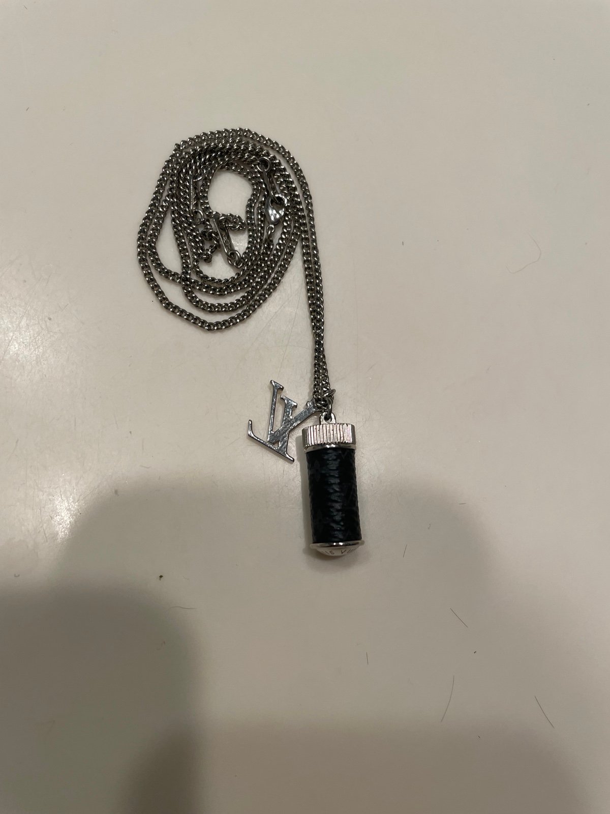 Louis Vuitton chain with vial