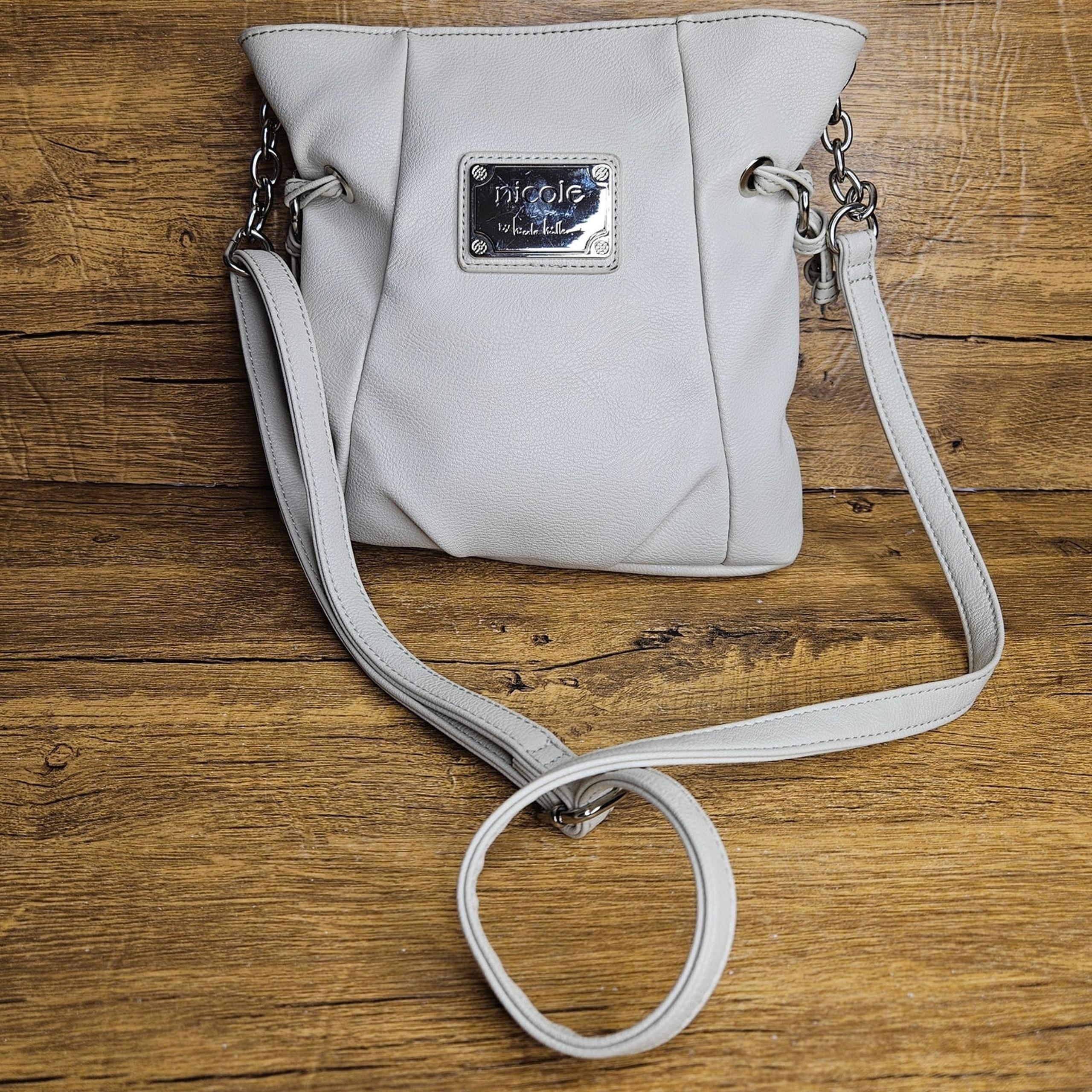 Nicole by Nicole Miller cream vegan leather crossbody purse 9in x 10in.