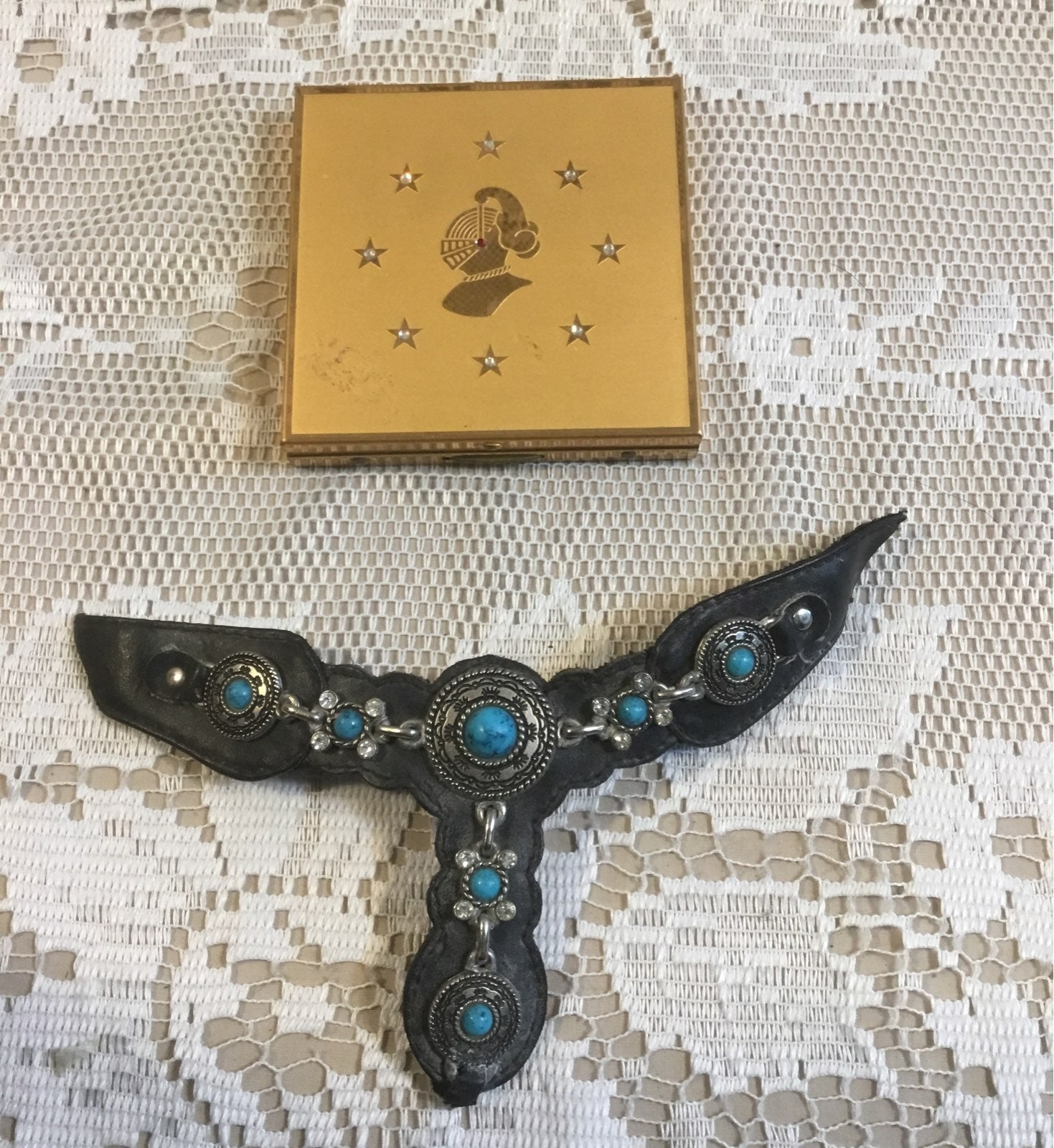 Compact mirror and leather piece
