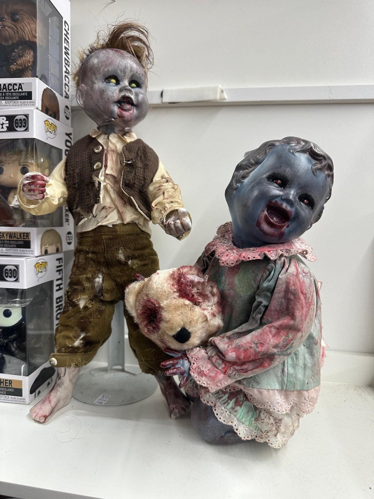 2 creepy porcelain dolls