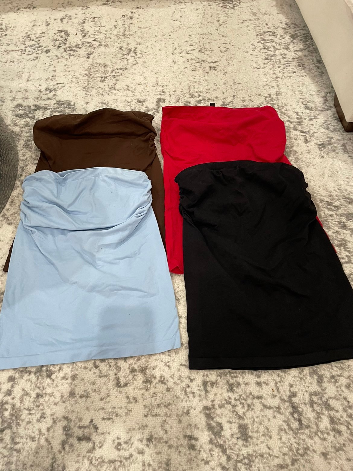 Set of 4 BEBE strapless tops. They have a built in shelf bra
