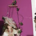 Vintage porcelain doll swinging