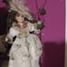 Vintage porcelain doll swinging