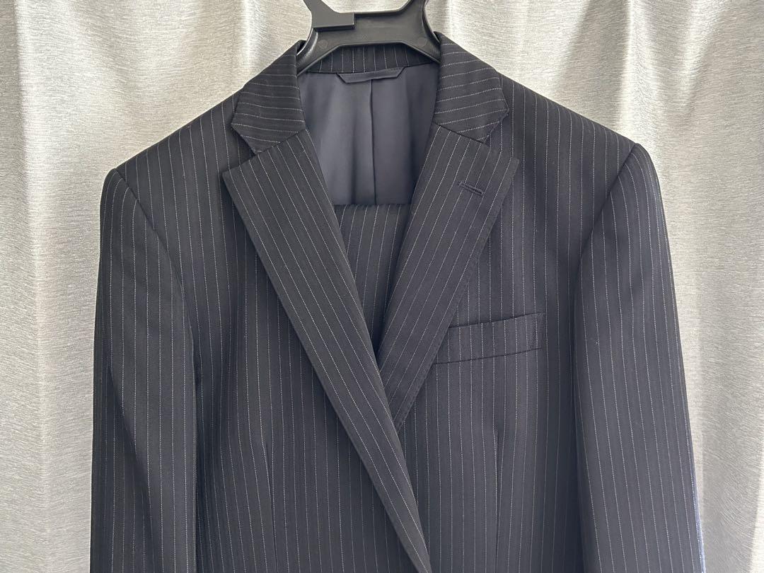 New Yorker business suit, navy blue with white stripes.