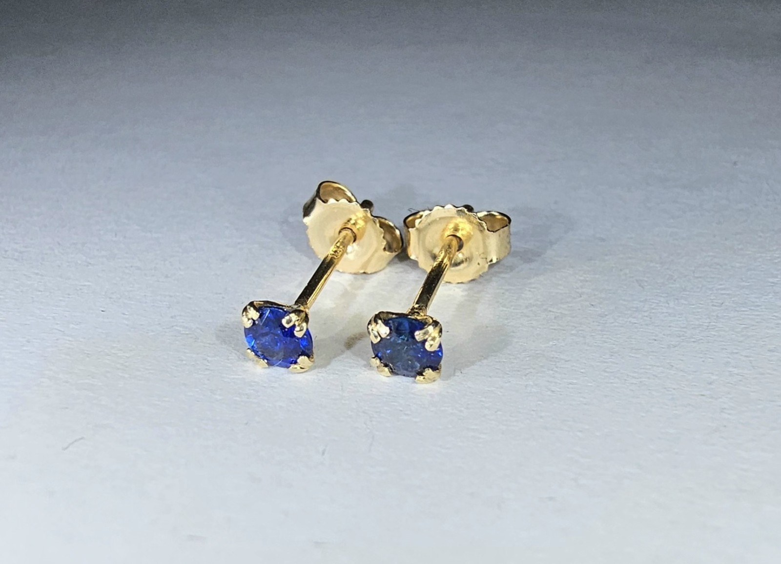 14k Yellow gold earrings with 3 millimeters genuine sapphires