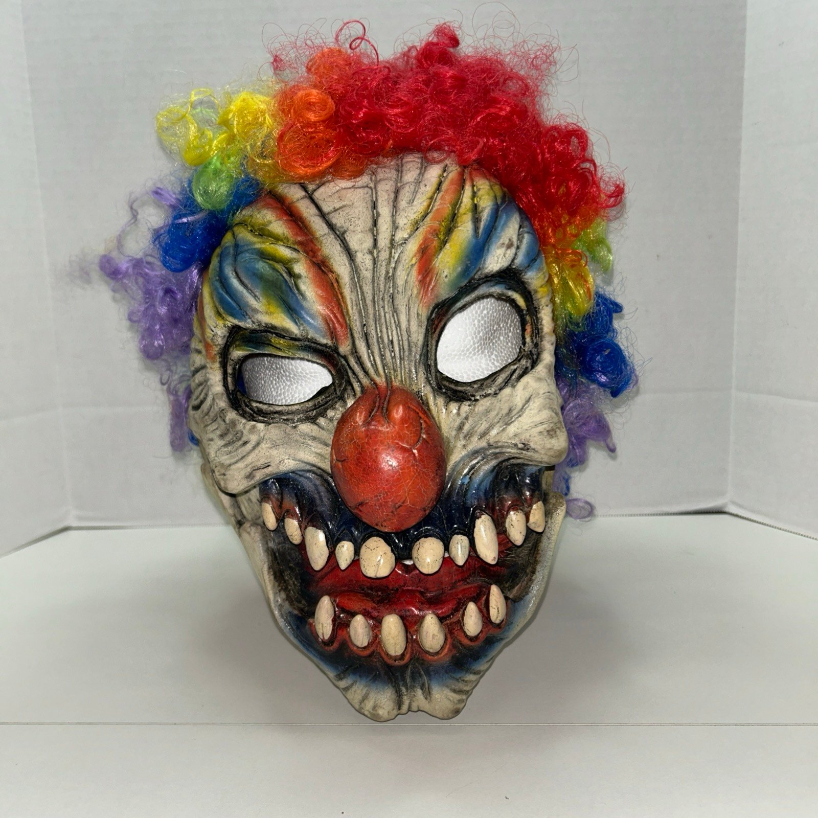Scary zombie clown with big red nose latex mask and multi-color hair - Halloween