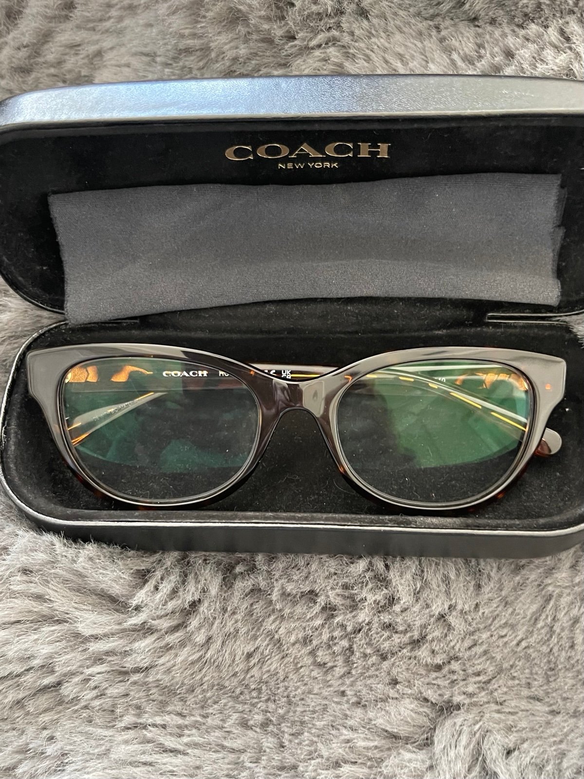Coach tortious shell and burgundy glasses.