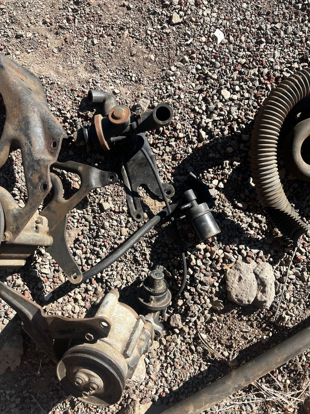 Assorted pumps and other parts off a clean emissions system on a big block 454