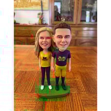 Michigan Fans Couple bobble head stand