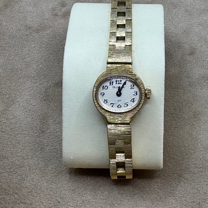 Women's Bulova Gold Watch with White Face