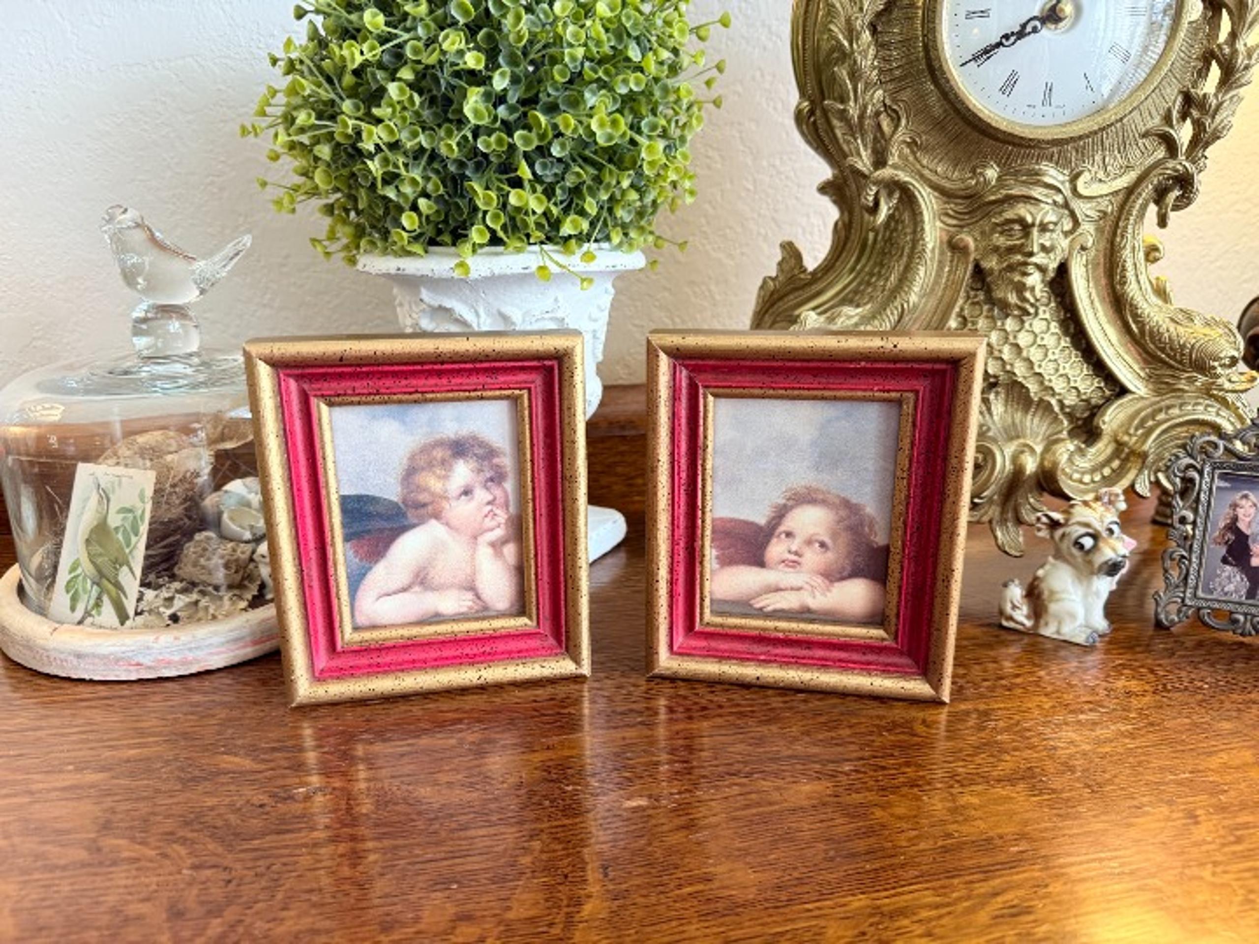 Set of two1976 Angel picture in wood frames