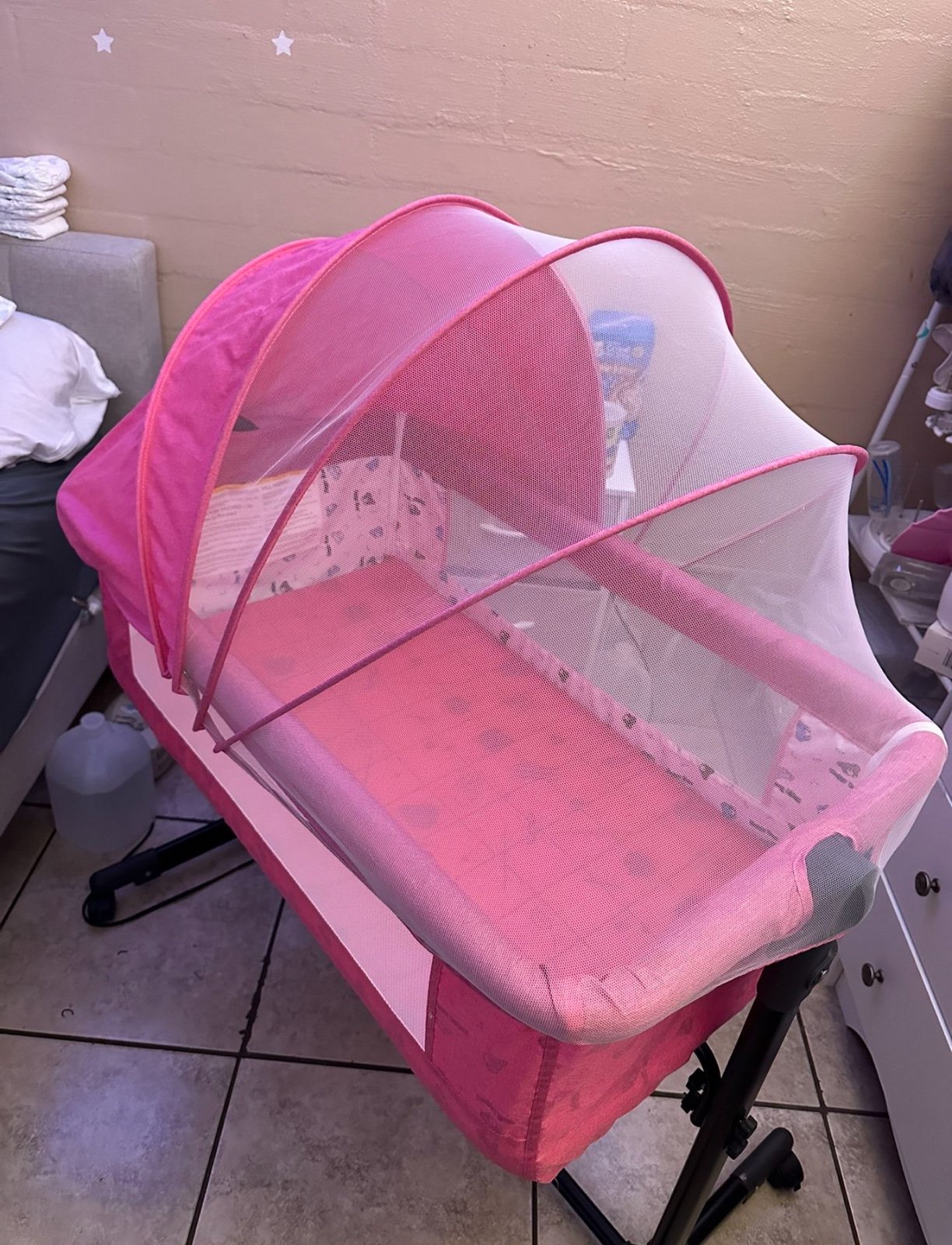 Pink Bed Side Bassinet & Pink Baby Bouncer seat.