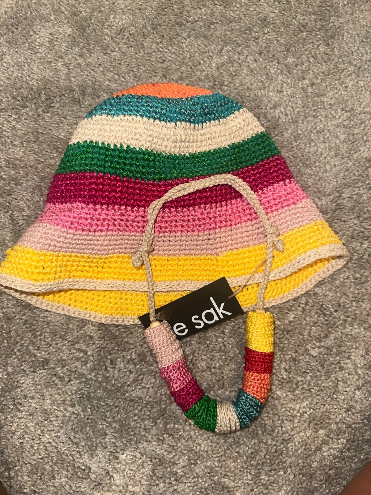 the Sak Necklace and Bucket Hat